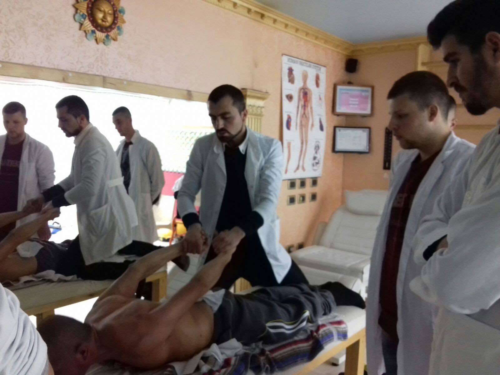 Physiotherapists working with a beneficiary during a supervised rehabilitation session